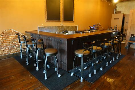Commercial bar - Here are some tips for bar decorating: Choose comfortable lighting. Lighting is very important in your bar area. Experiment with different lighting styles and dimmers. Bars are usually dimly lit, but if you are going to have a seating area you might want to install overhead lighting over tables. 